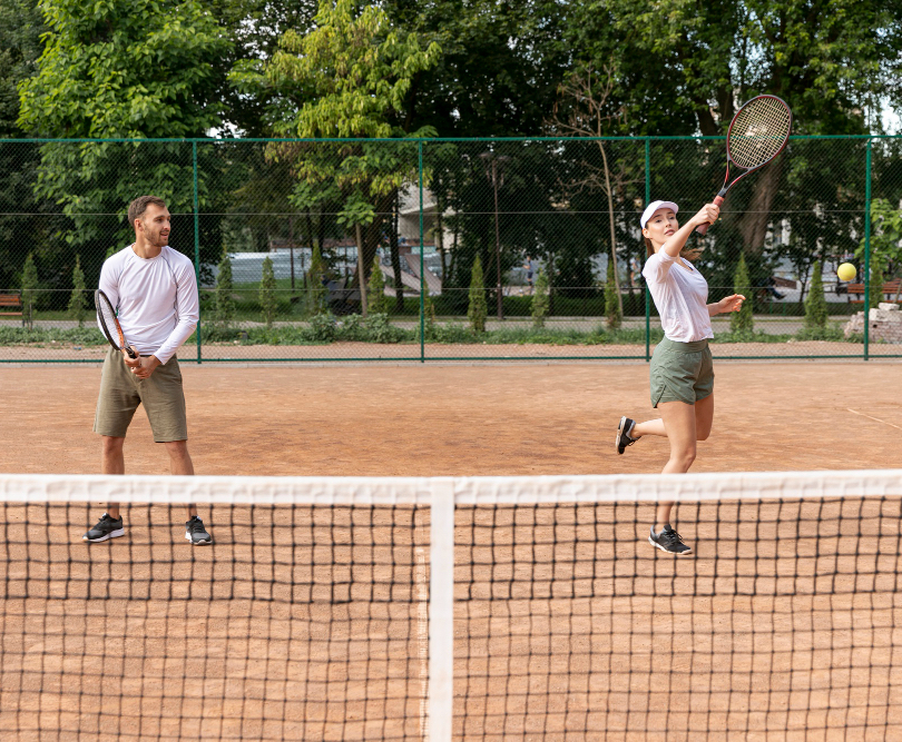 Tennis Hampshire A couple playing tennis in Hampshire at Beechdown.