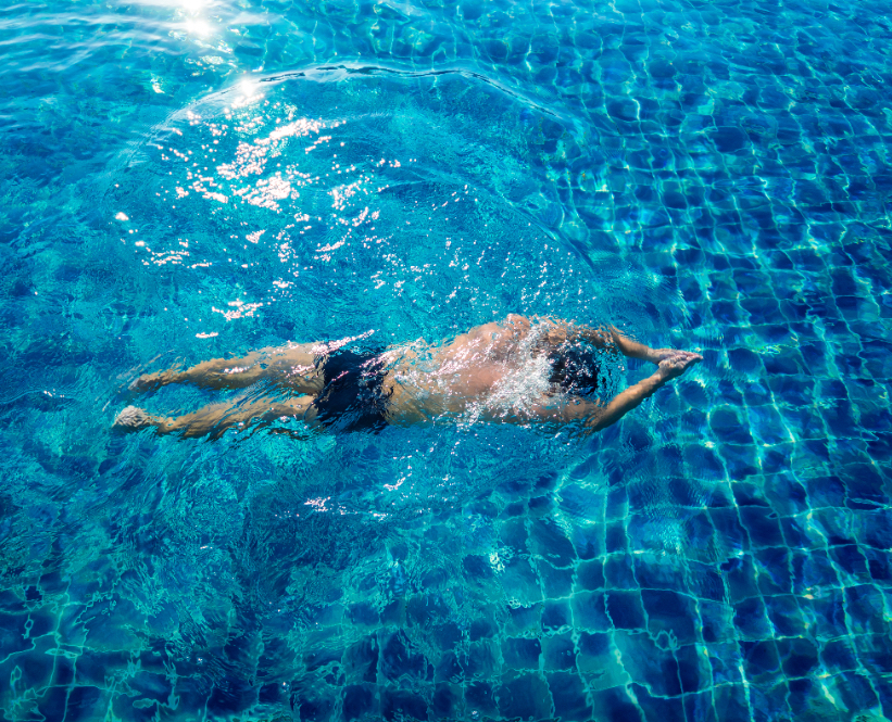 A man enjoying calming pool as part of Beechdowns bespoke spa breaks in Basingstoke.